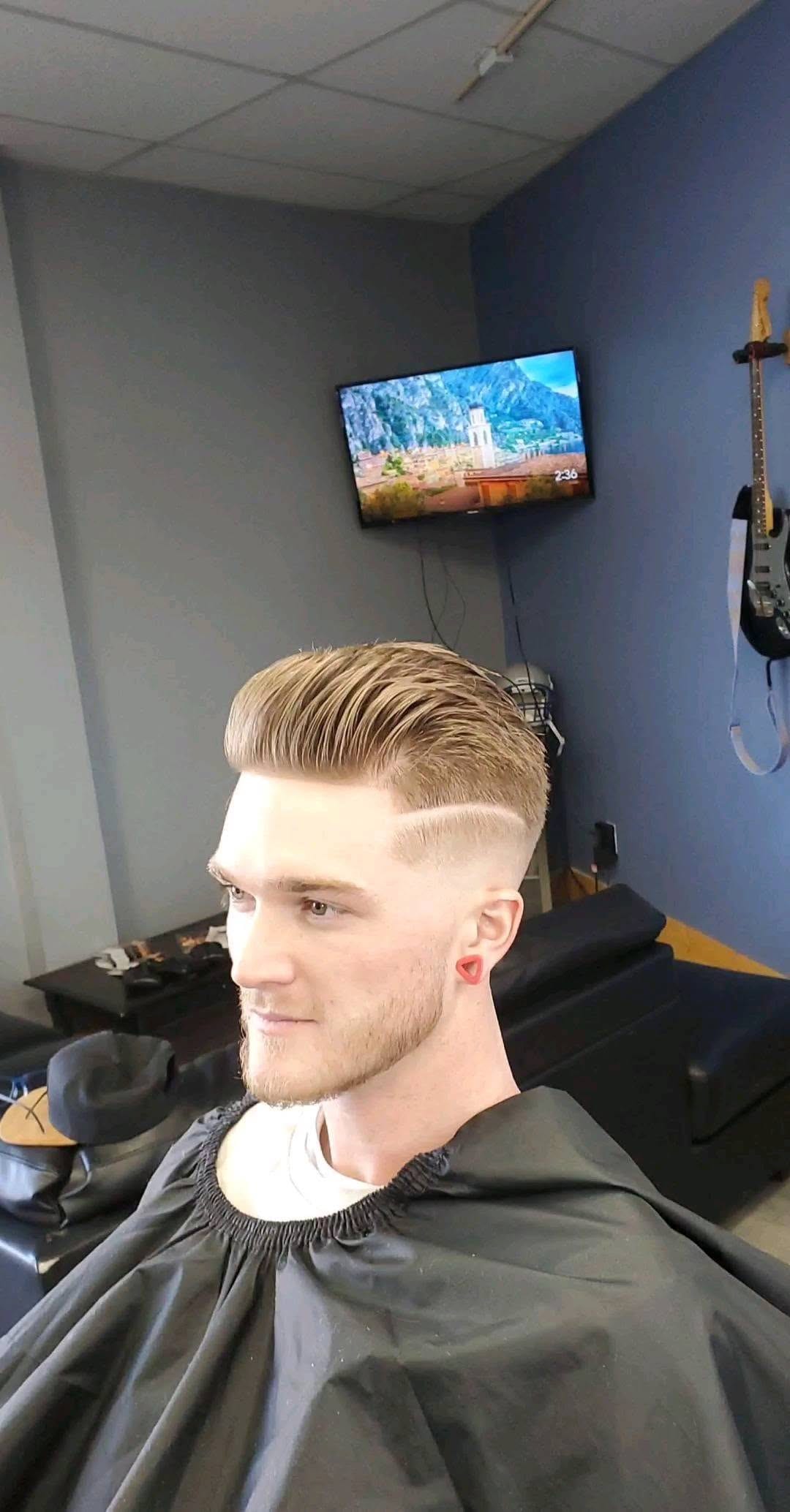 Blond haircut beneath a barber cape