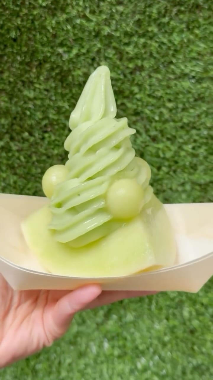 Honeydew sorbet soft serve served in a fresh melon wedge