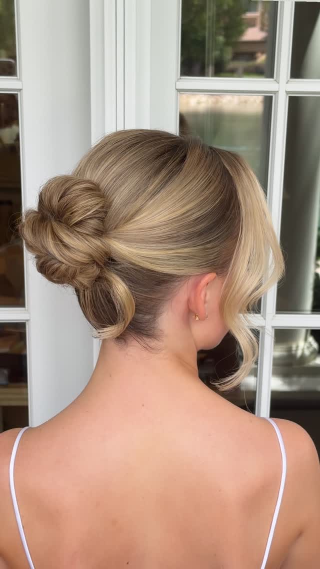 Close-up of a blonde low bun hairstyle