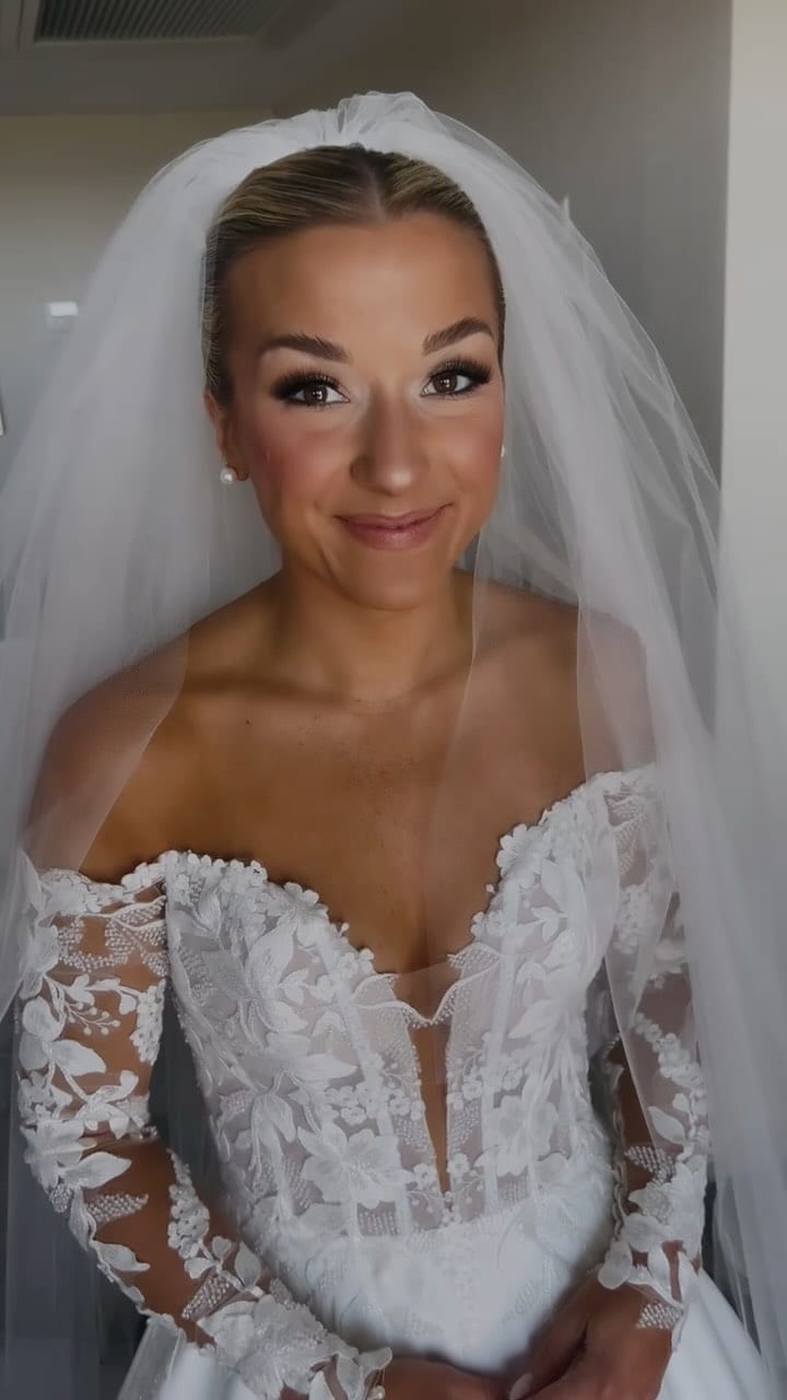 Bride in a white lace wedding dress and veil