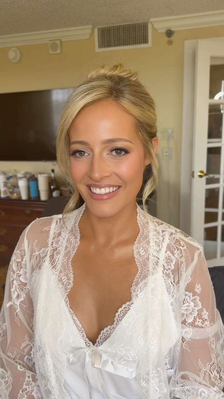 Blonde bride in a white lace robe